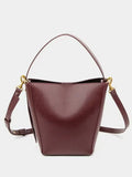 Urban minimalist crossbody shoulder bag in bucket style, PU material, solid colour, three-dimensional outer pocket, available in black, army green, and wine red