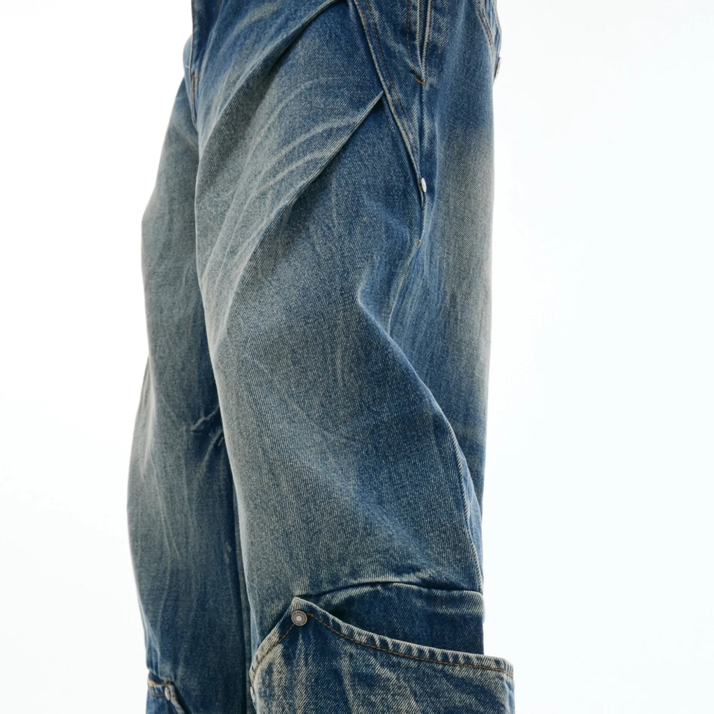 Men's verdant blue retro jeans with a curved knife cut and washed burst pattern