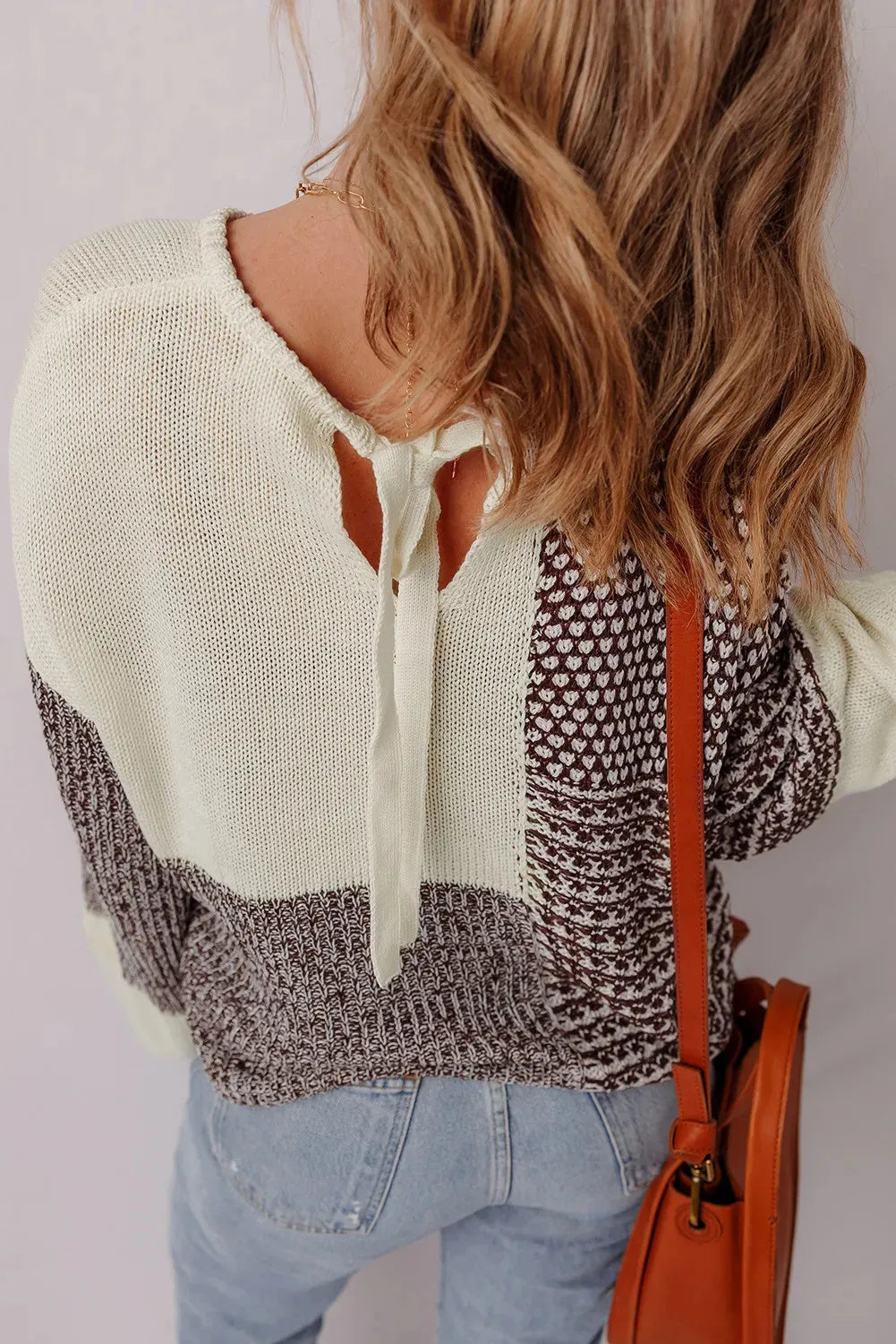 Dark khaki colour block women's loose sweater with drop shoulders and a back tie detail.
