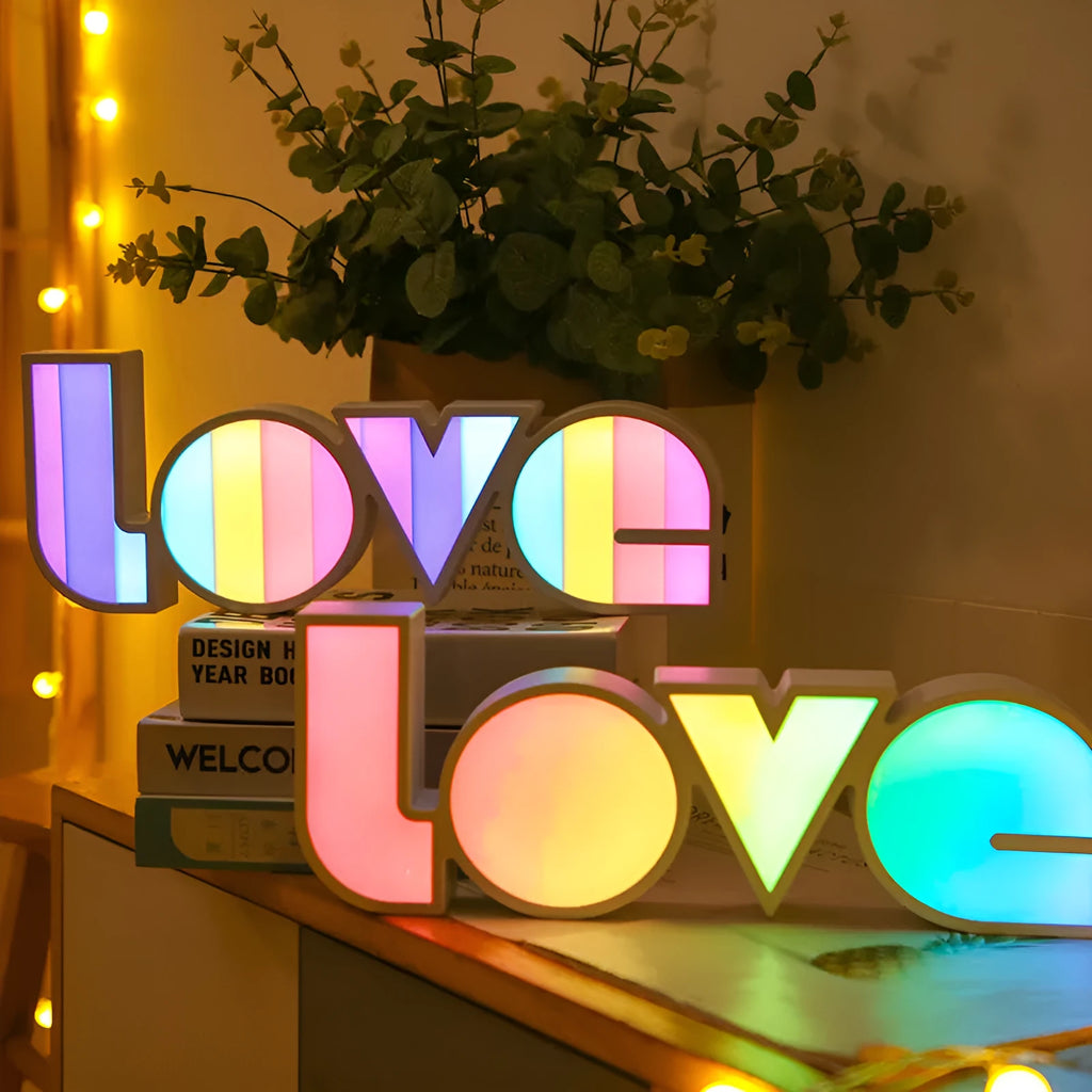 Colourful LED love light decorative lamp with plastic shell on a table