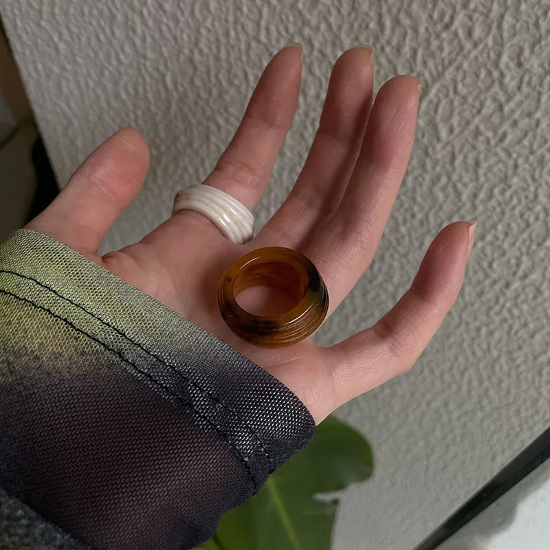 Chinese style geometric resin ring with irregular wide band design in brown and white colour options