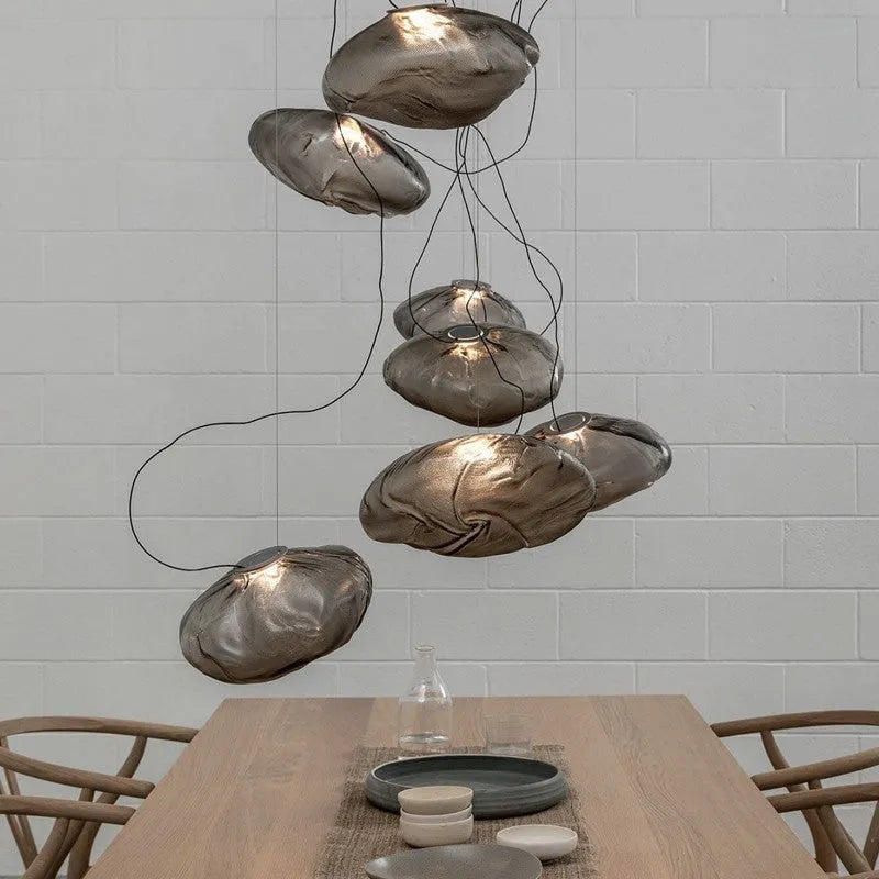 Modern fabric-style glass LED chandelier with clear, amber, or smoke grey shade, shown in small and large sizes.