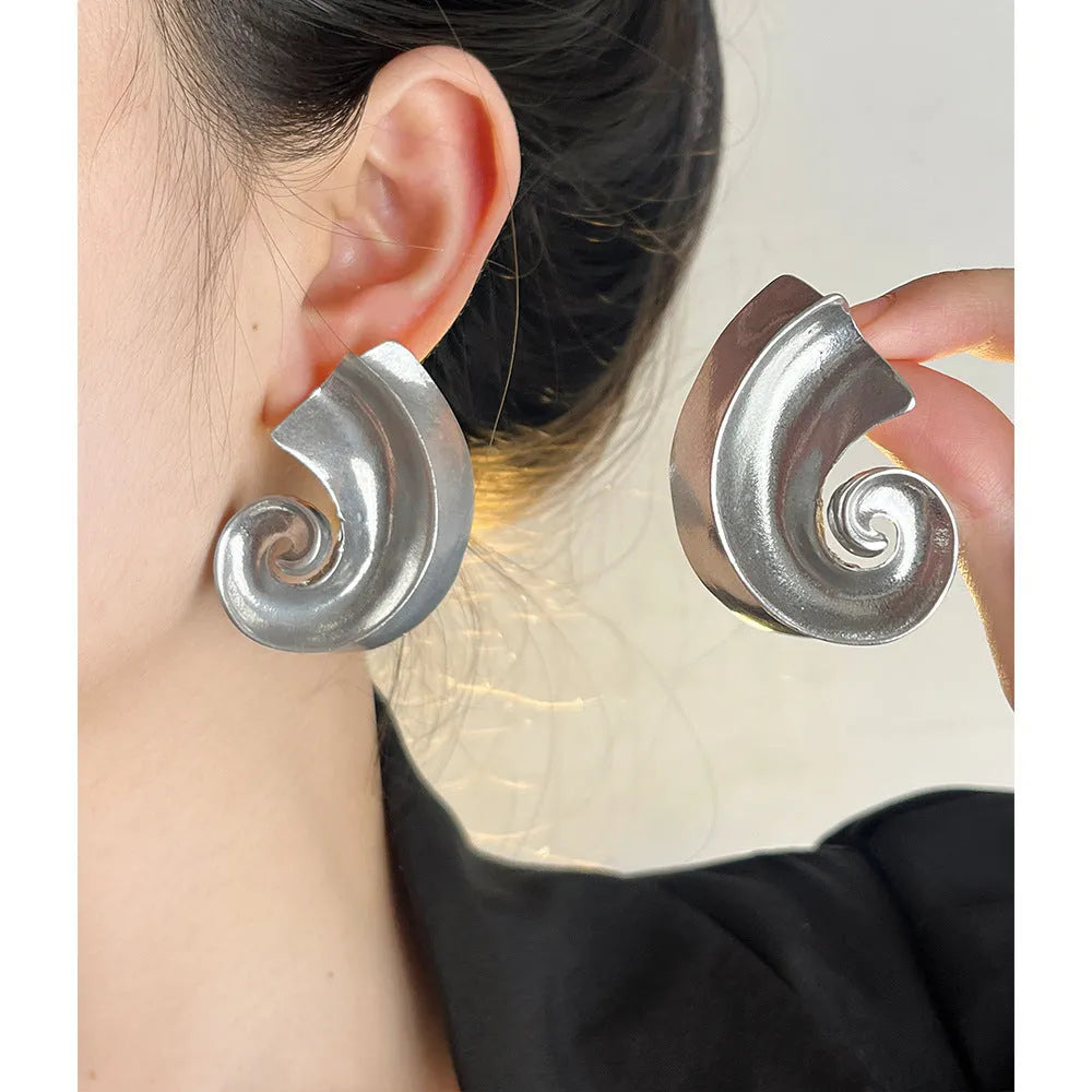 Geometric retro design ear studs in gold and silver colours measuring 5cm