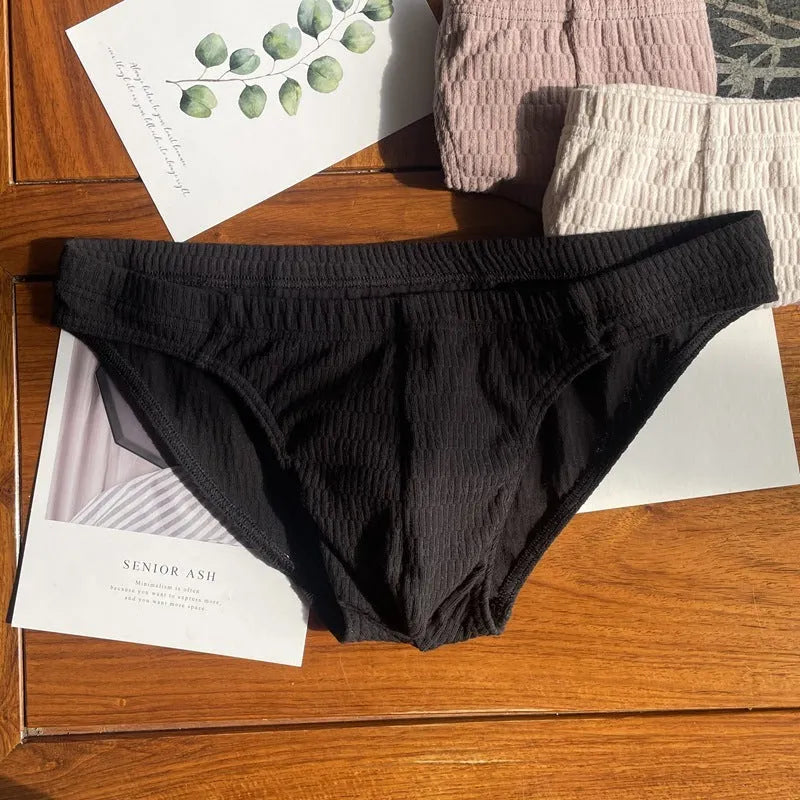 Men's solid colour pure cotton triangle briefs with a mid-waist body-shaping design.