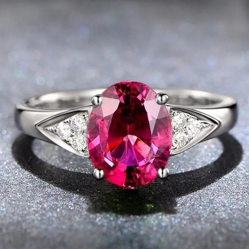 Women's blue zircon court style ring with heart, water drop, and bell pattern designs.