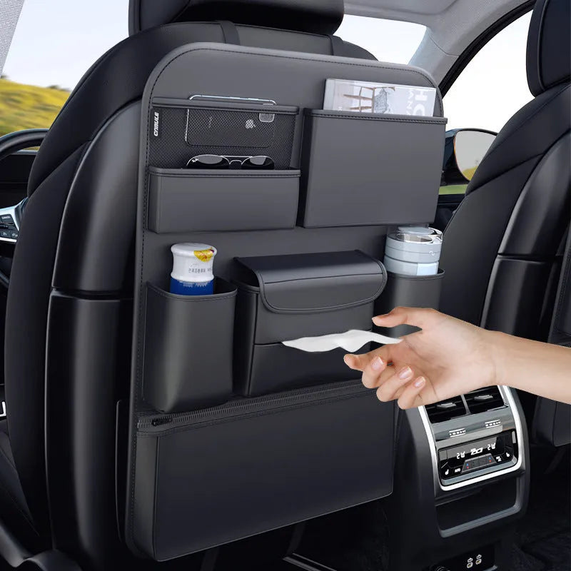 Black leather car seat back hanging storage bag with carrying handle shown in vehicle