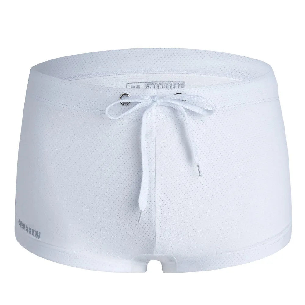 Men's low waist boxer style nylon swimming trunks in multiple solid colours