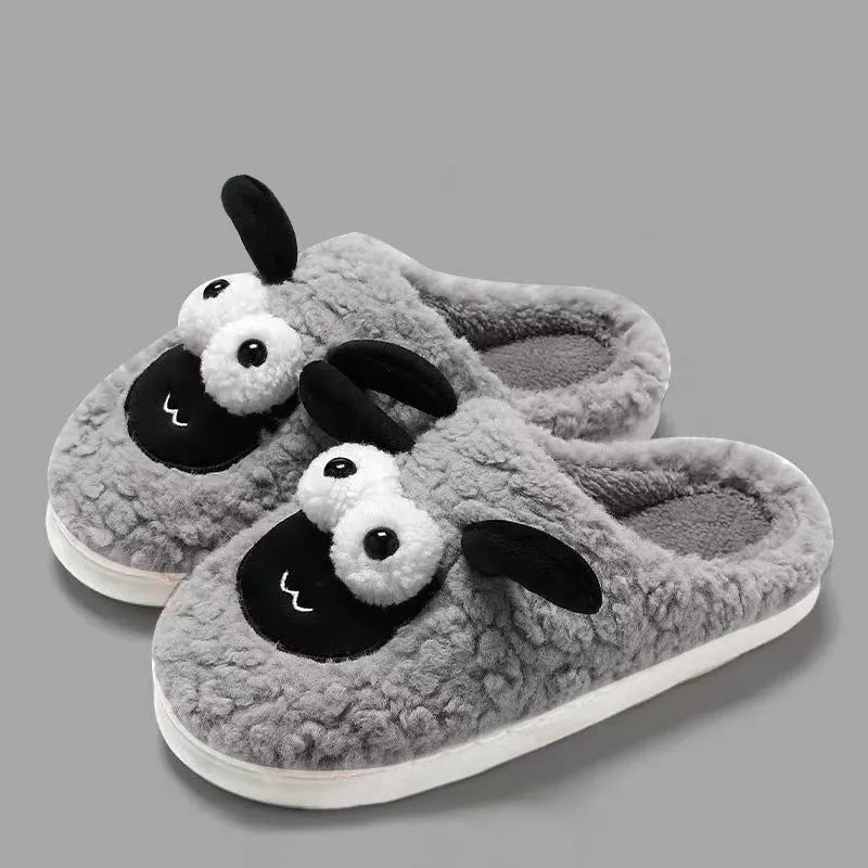 Brown thermal cotton slip-on slippers with suede upper and textured PVC sole on a wooden floor.