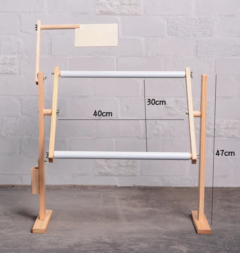 Solid pine wood vertical embroidery frame with height adjustment mechanism on a desktop