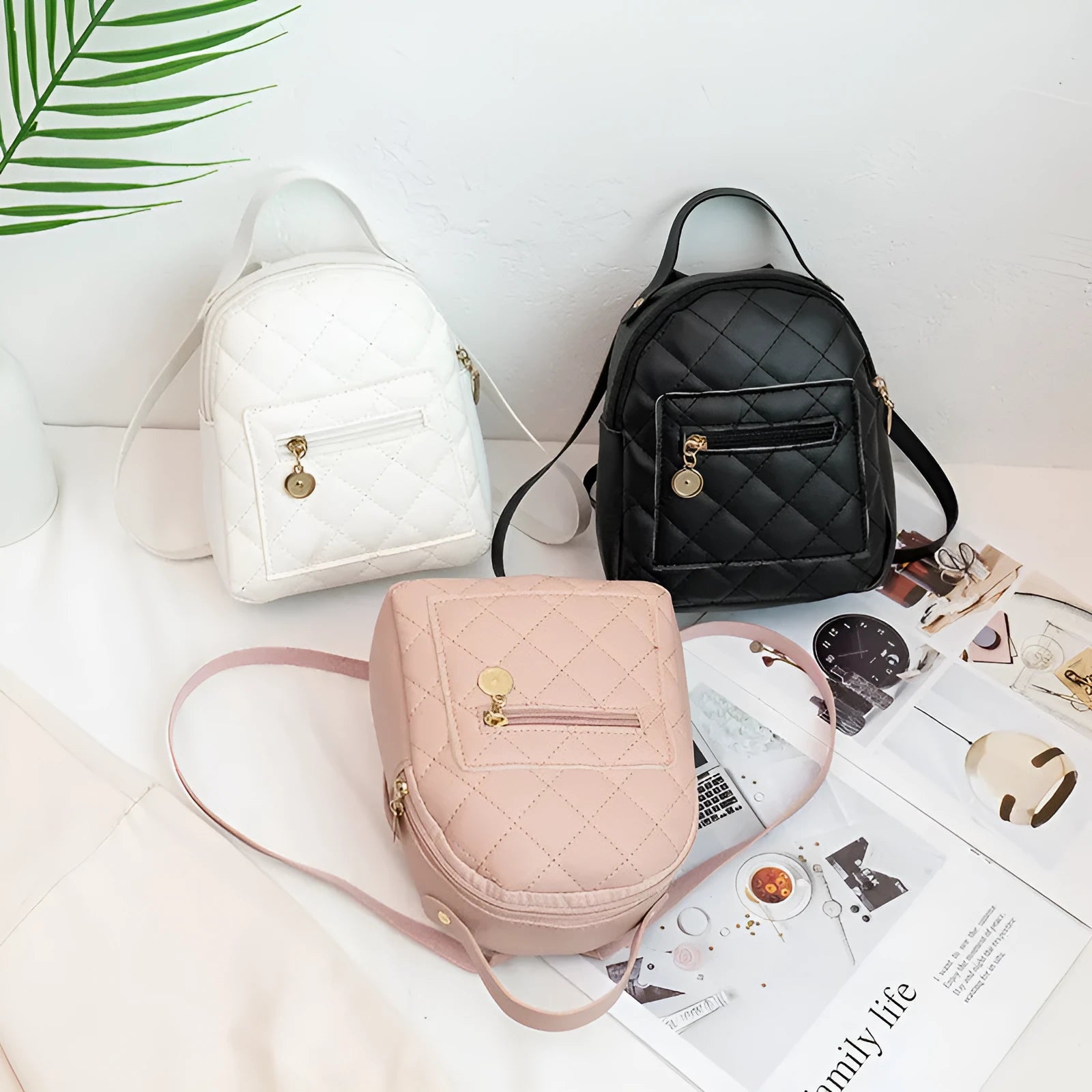 Hard white Korean style embroidered girls backpack showing sandwich pocket and soft carry handle.