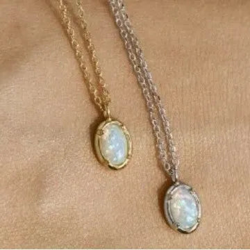 Oval jelly opal pendant necklace on a silver chain with choice of gold or white gold finish.