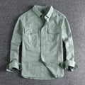 Men's light grey loose fit cardigan-style shirt with an overalls design and long sleeves.