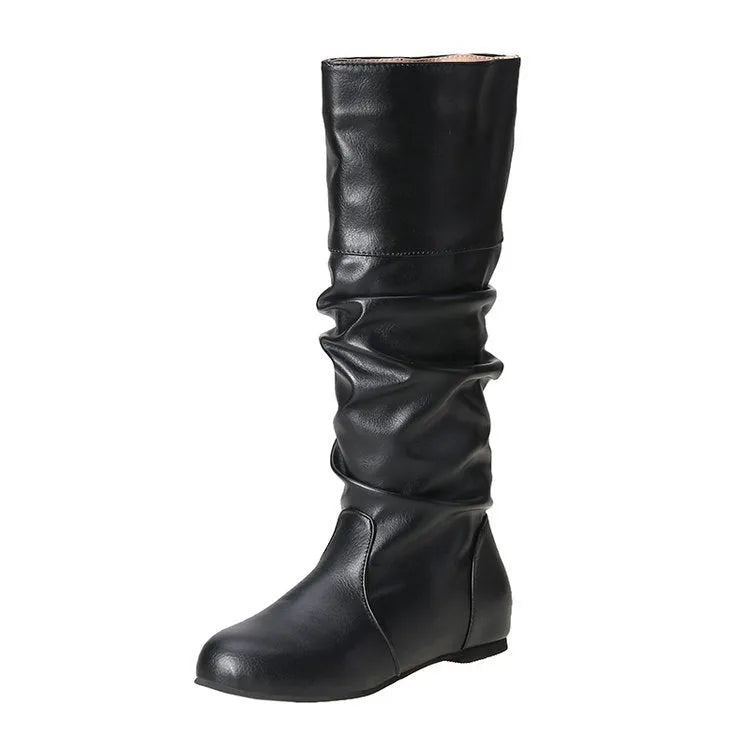 Women's flat ankle boots in black with a round toe and slip-on design on a rubber sole.