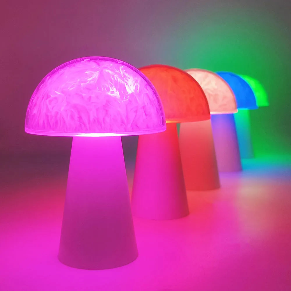 Mushroom-shaped remote control night light with RGB colour changing on wooden surface