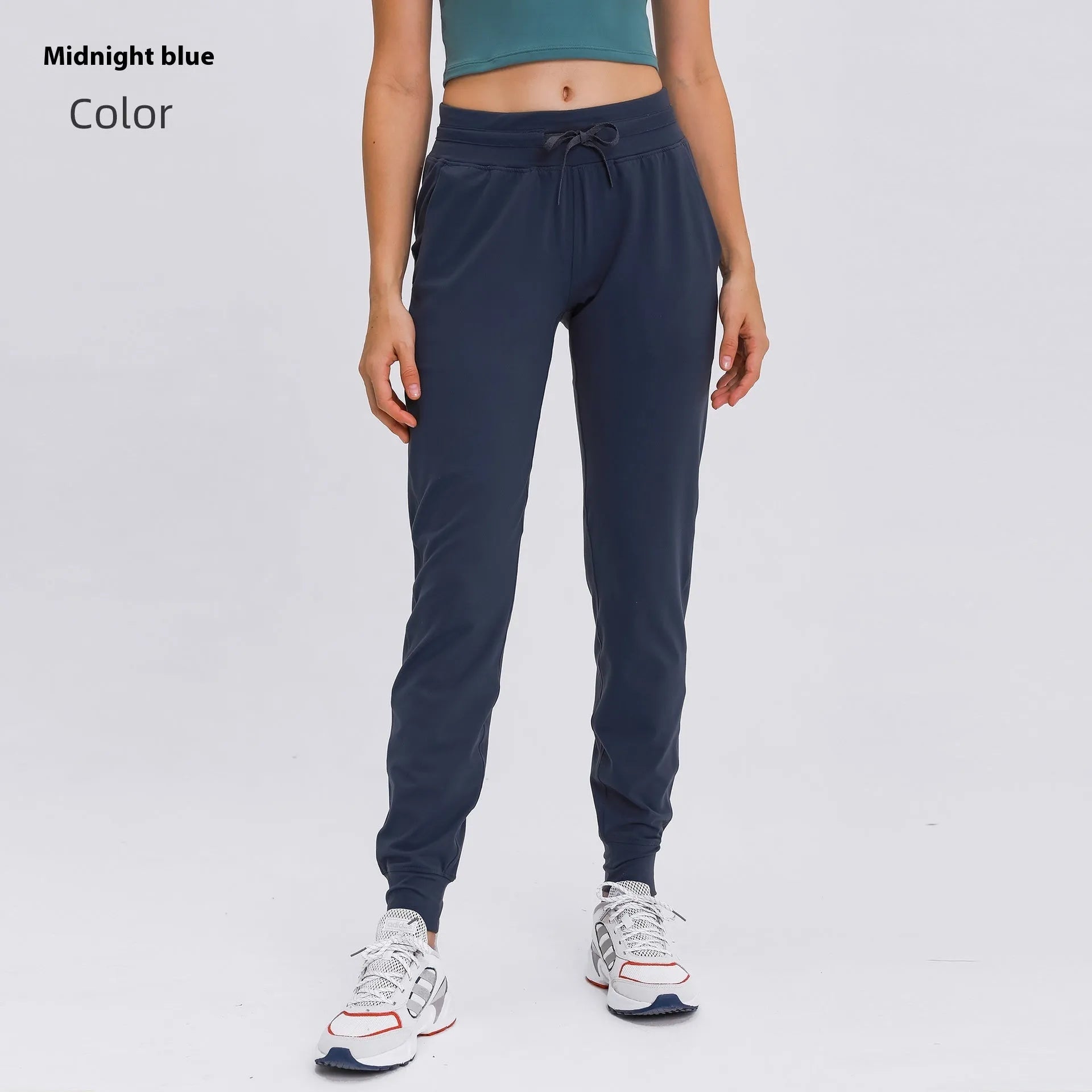 Women's high-waist yoga pants in distilled coffee colour with an elastic drawstring waist for fitness.