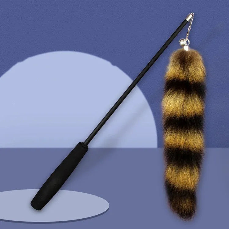 Black cat toy wand with feather teaser on elastic string measuring 42cm