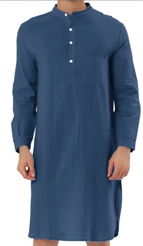 A man's long-sleeve cotton shirt robe in a light blue colour, showing a button front and chest pocket.