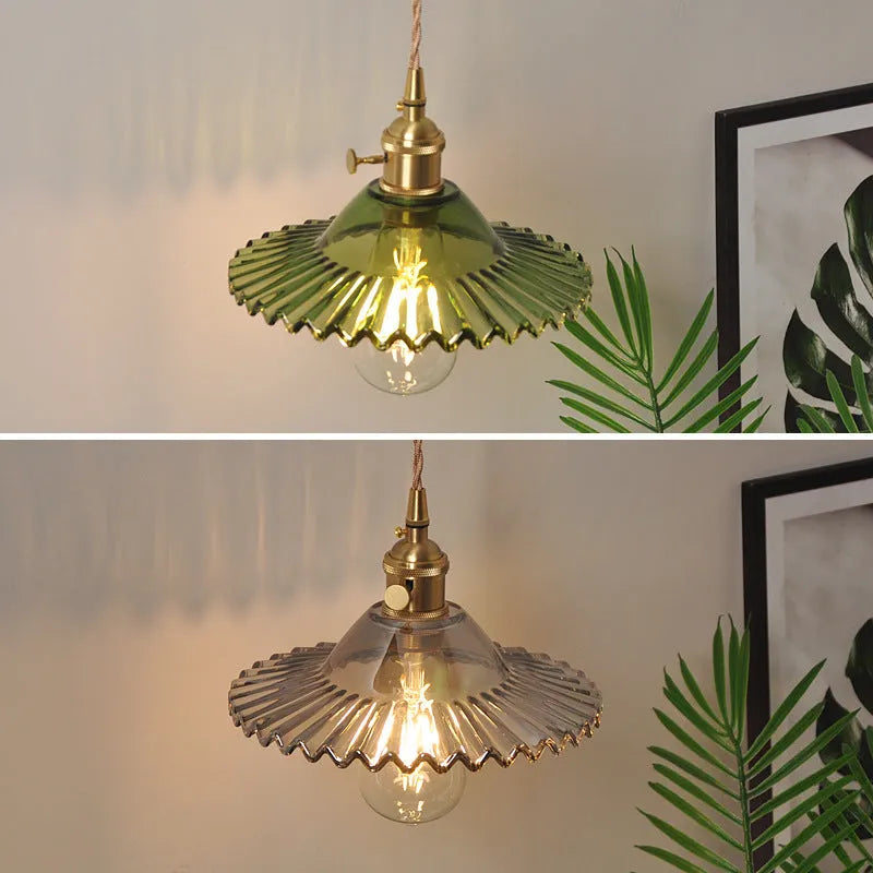Retro brass lotus wall lamp with a glass shade in a choice of six colours.