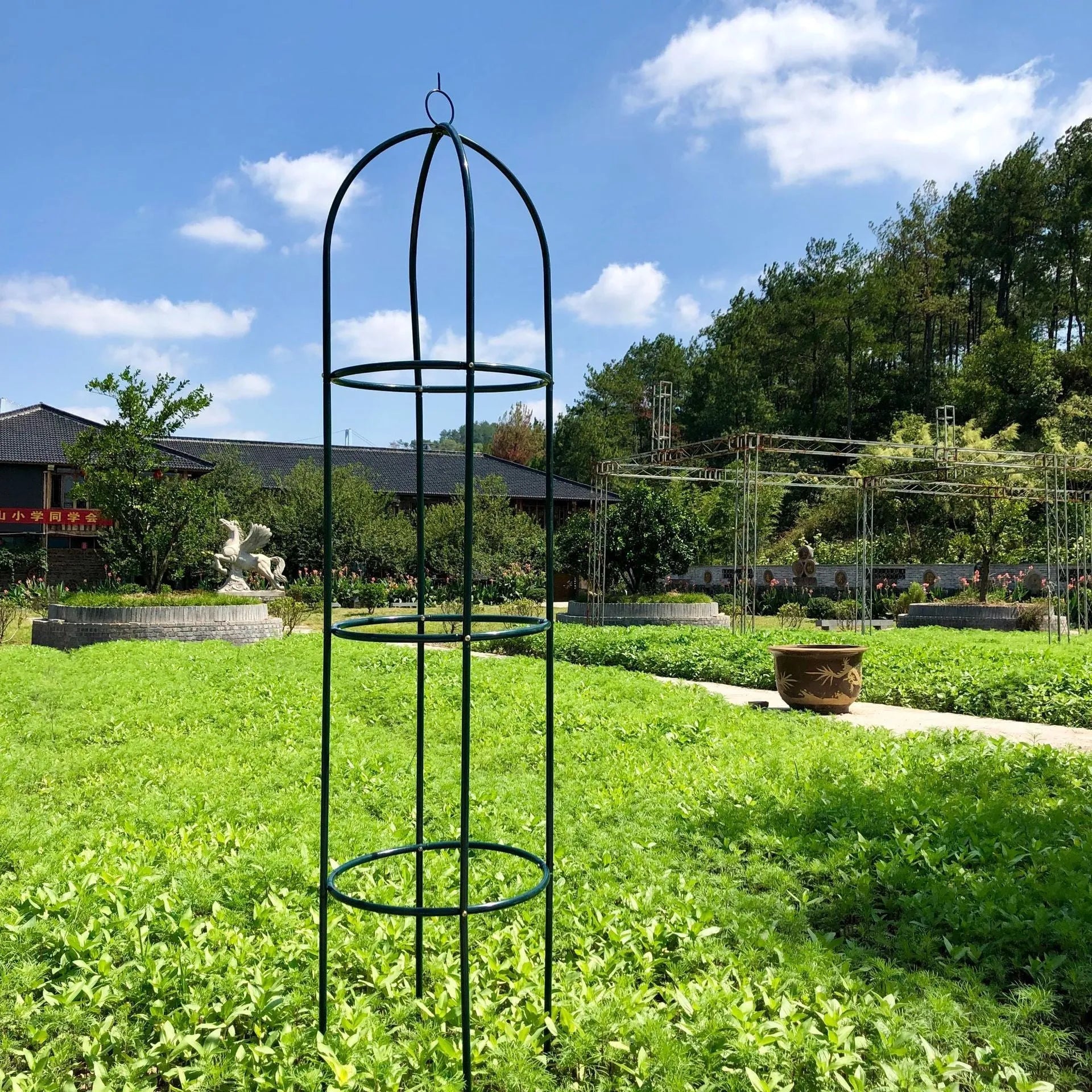 Dark green wrought iron plant climbing frame lattice, 188 cm tall by 40 cm wide.
