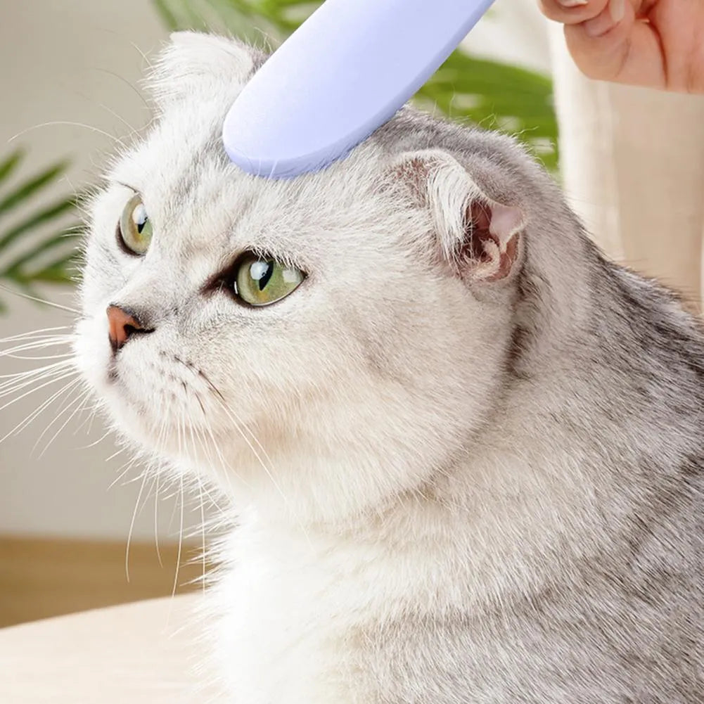 Grey and pink ABS plastic cat grooming comb with tongue-mimicking massage design