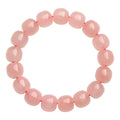 Pink natural crystal barrel bead bracelet with 8x10mm geometric design and polished finish
