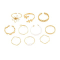 Gold tone openwork flower ring with electroplated glossy finish and women's jewellery design