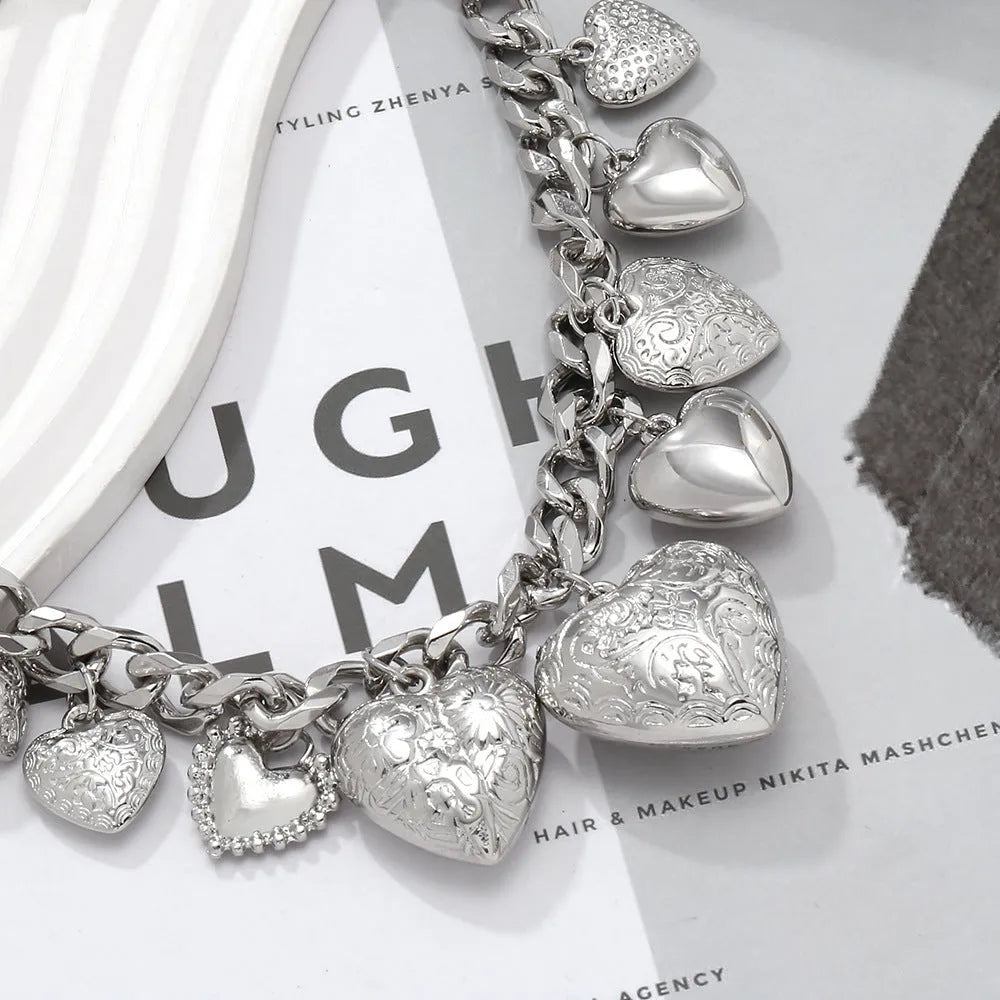 Women's exaggerated carved heart pendant necklace with dripping oil finish in gold and white K colours