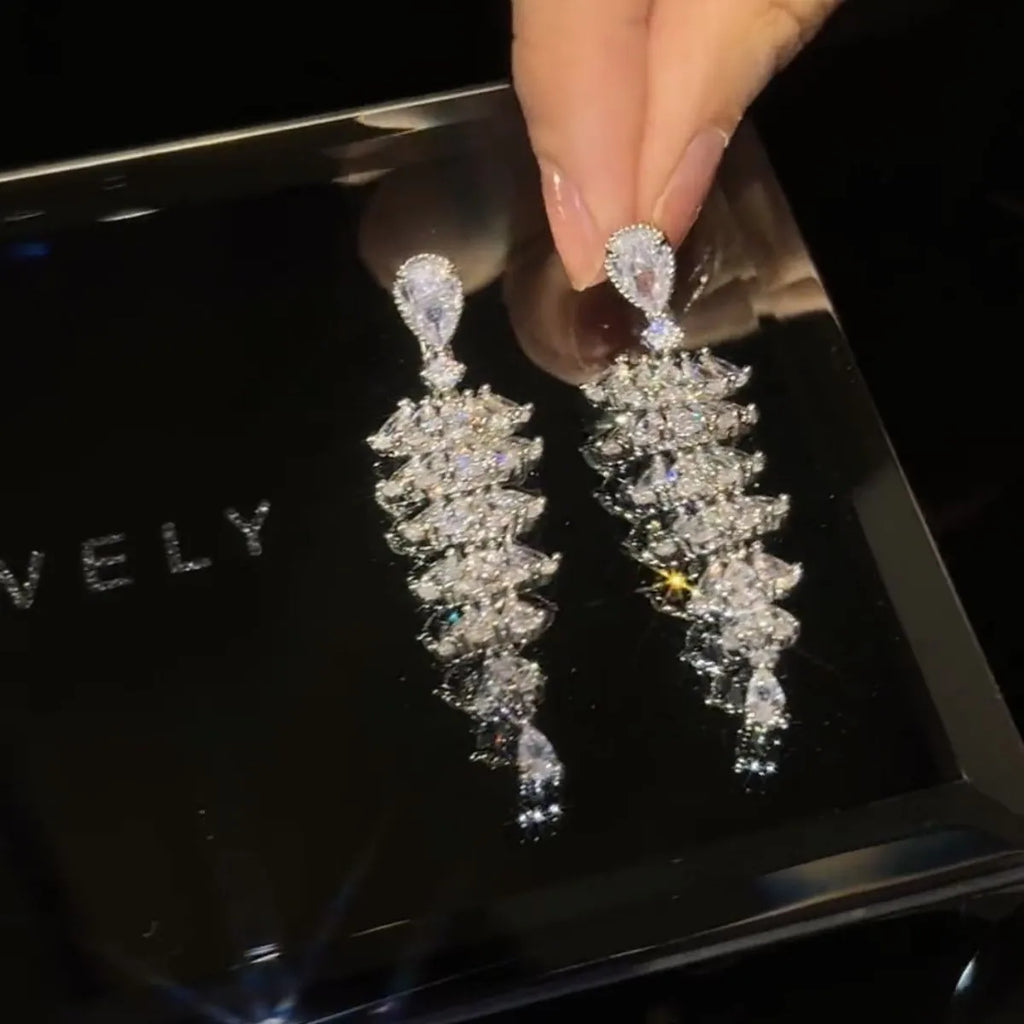 Christmas tree shaped drop earrings with sparkling zircon stones in silver pagoda colour