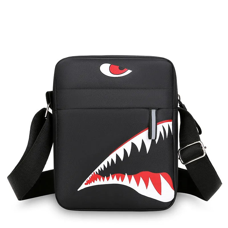 Men's small black Oxford cloth crossbody bag with animal print pattern and shoulder strap.