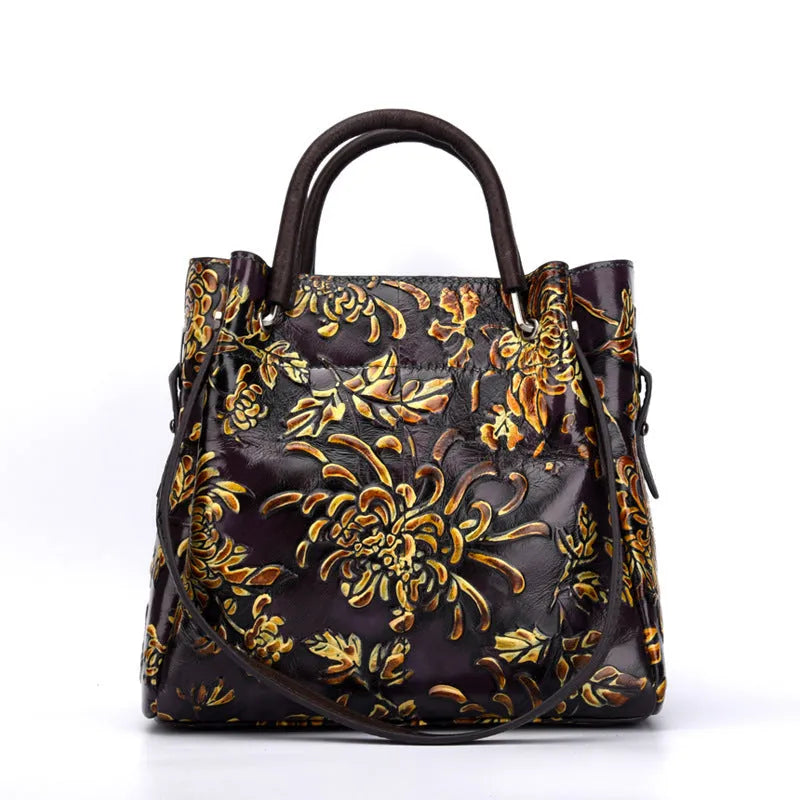 First layer cowhide women's messenger bag with embossed floral pattern, retro square shape, hard handle, and single shoulder strap in brown