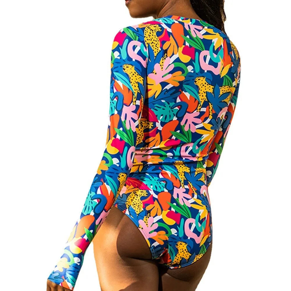 Women's printed polyester one-piece long sleeve surf swimsuit in blue, with spandex lining, front view