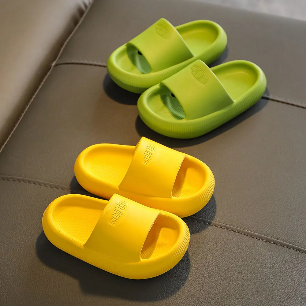 Mixed colour children's EVA slippers with non-slip soles in sizes for ages 24-35.