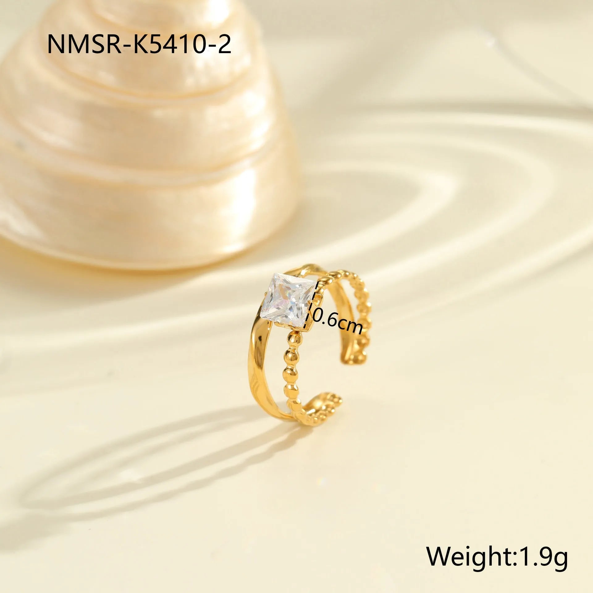 Stainless steel women's ring with gold electroplating and zircon details in geometry design