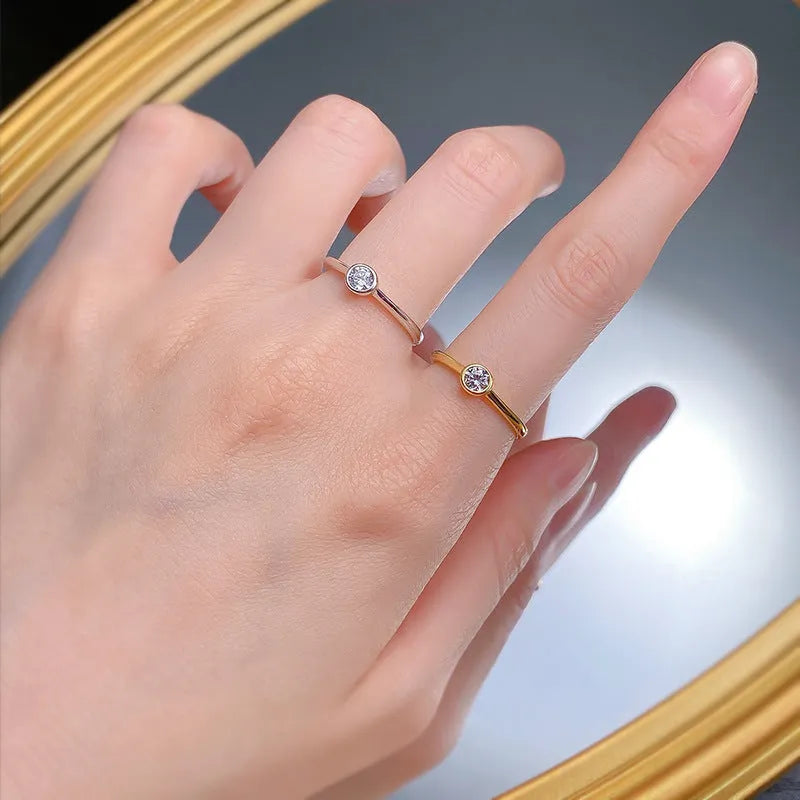 Minimalist silver crown ring with line design in gold or platinum finish on a size guide