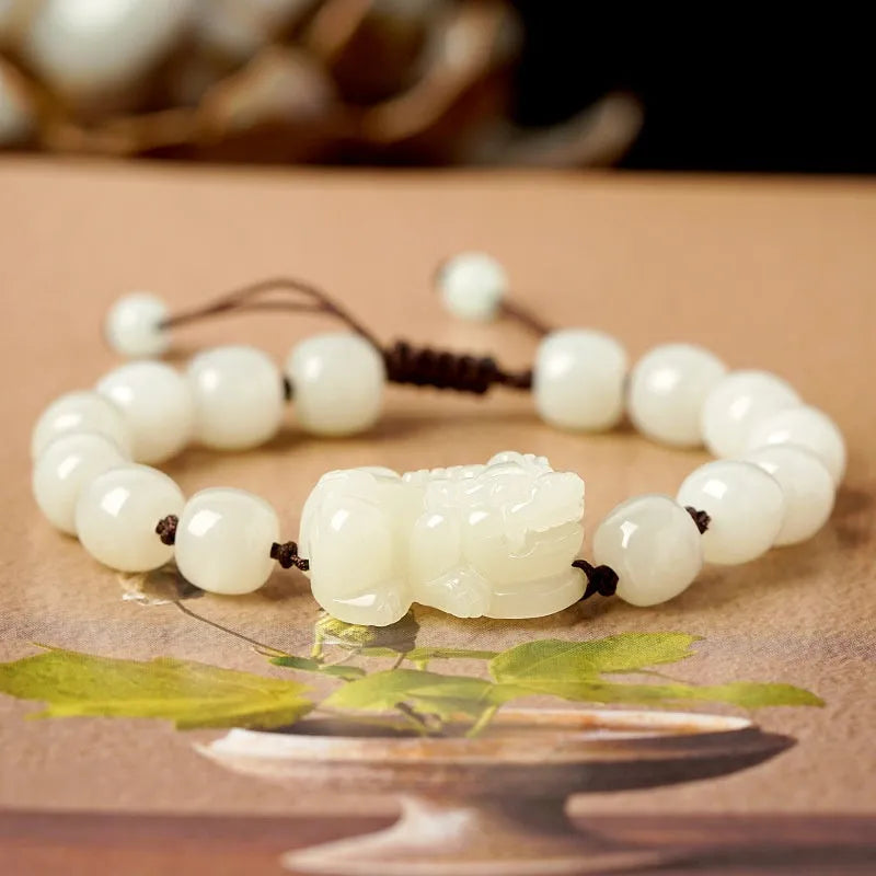 Hetian jade bracelet with braided rope closure in traditional Chinese style