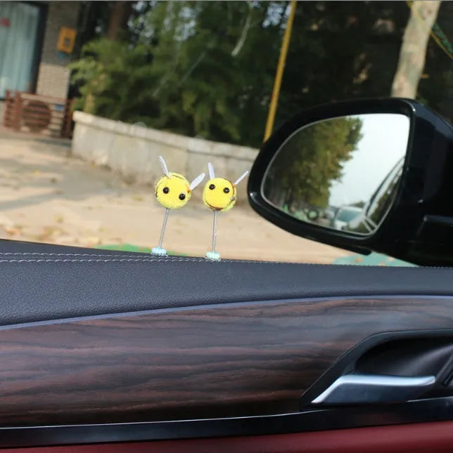 Soft fur ball bee car decoration measuring 3x3 centimetres with cartoon design