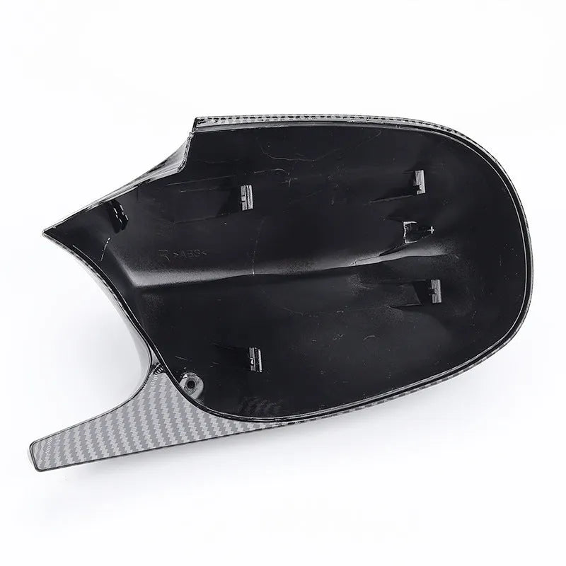 Pair of black ABS plastic rearview mirror housings for BMW 3 Series E90 on a white background.