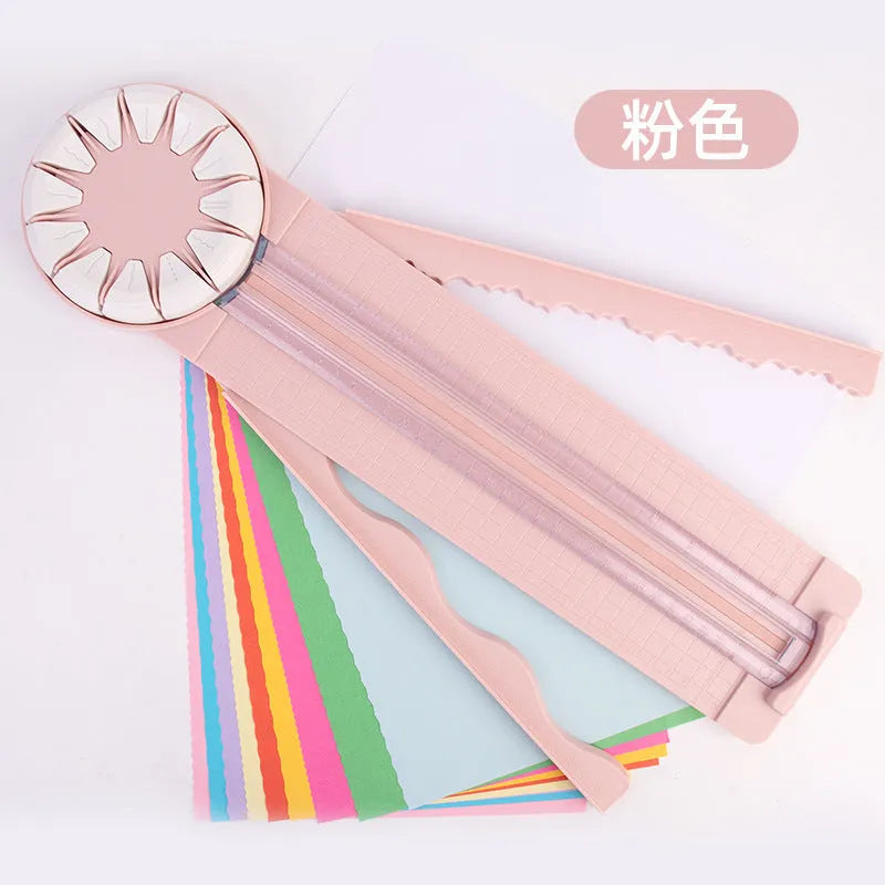 Plastic paper cutting machine with 12 patterns in pink colour on craft table