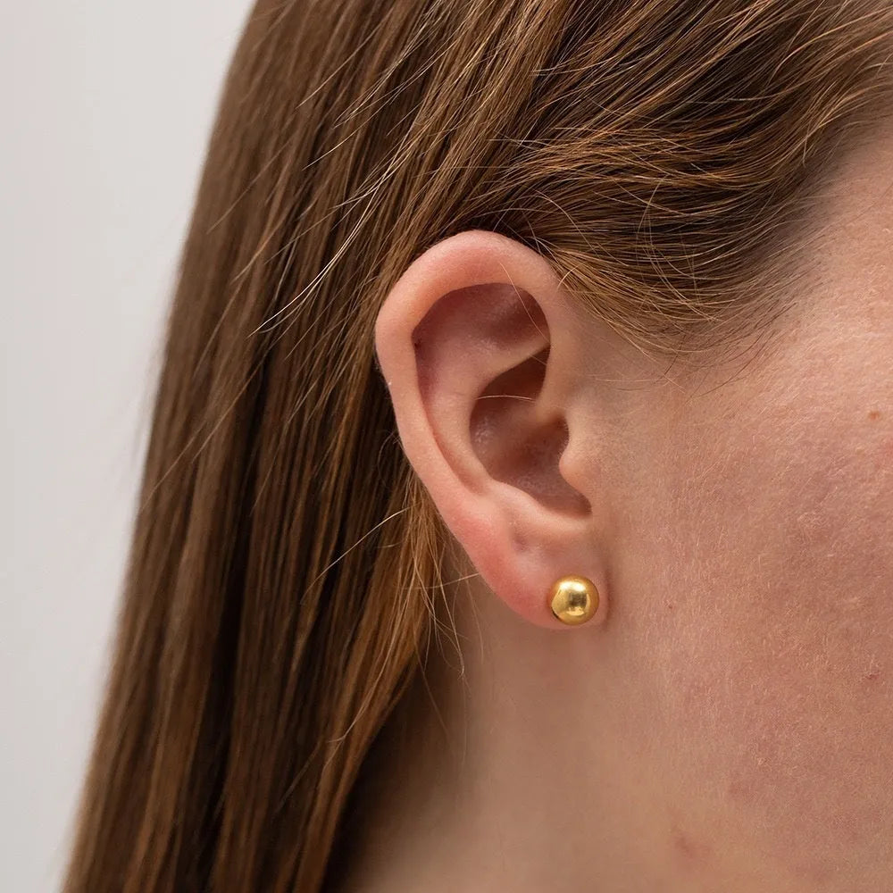 Stainless steel ball stud earrings in gold and silver finishes, showing 3mm to 6mm size comparison