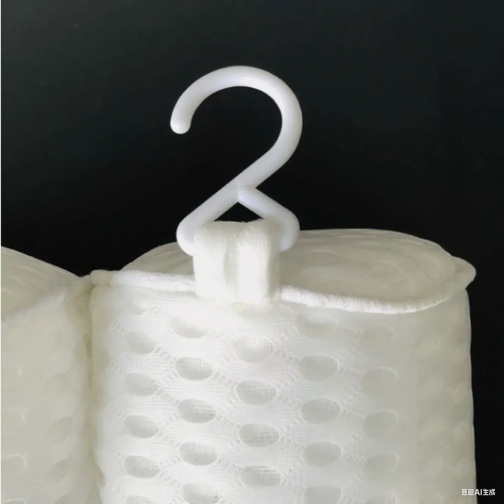 White 4D mesh bathtub pillow with multiple suction cups on a light luxury styled bath mat.