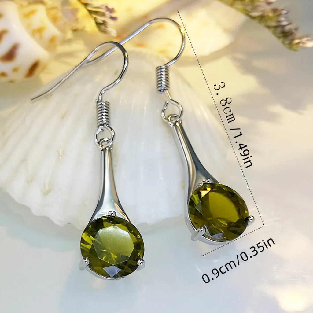 Olive green topaz drop earrings with water drop shape and retro styling