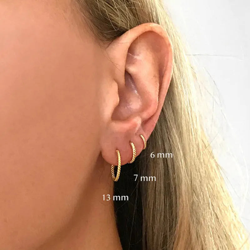 Sterling silver twisted hipster earrings in geometric round design with gold or platinum plating