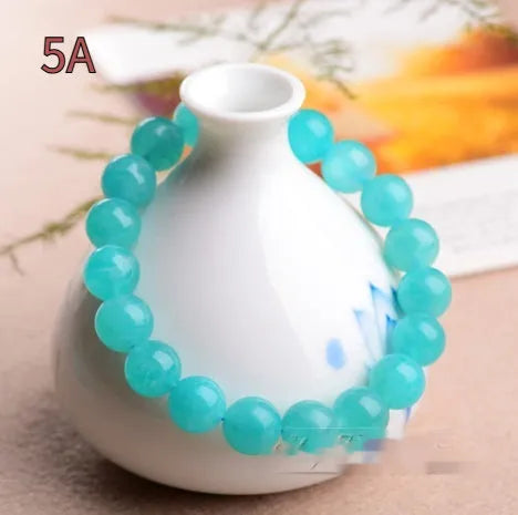 Natural amazonite scattered beads in ice colour with polished surfaces, showing single circle and three ring styles
