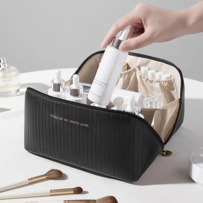 Vertical pattern pillow makeup bag in cubic design measuring 22.5cm height with travel storage capacity