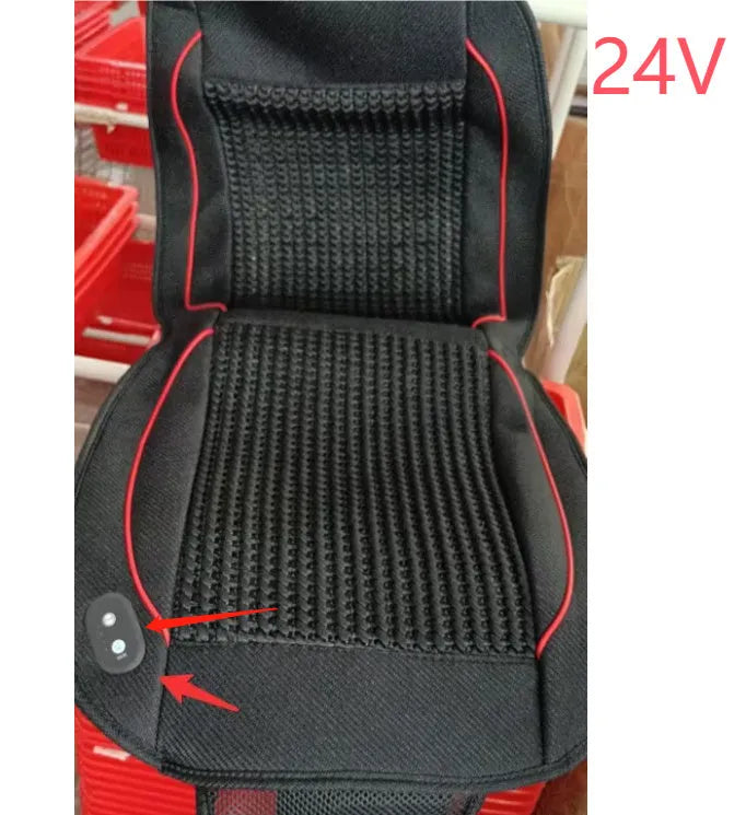 Square black car seat ventilation cushion with power cord, shown on a car seat.