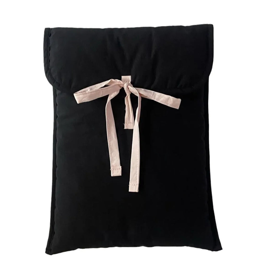 Black and white quilted women's laptop bag with a ballet bow and striped pattern.