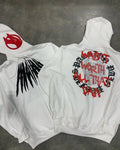 Black loose hooded sweatshirt with white printed skull design and rhinestone details, cardigan style.