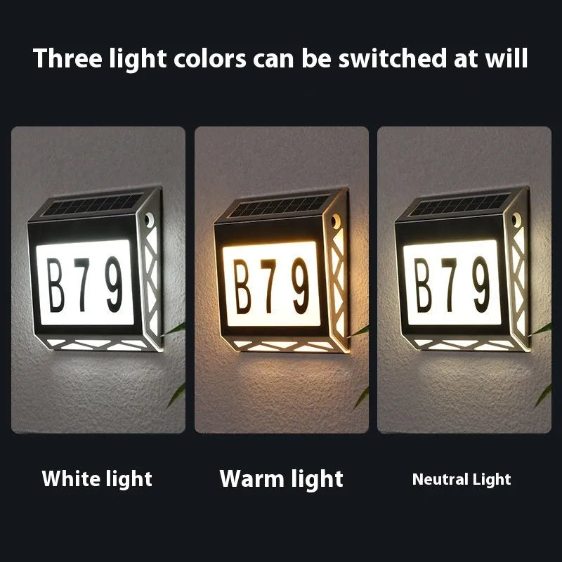 Solar powered doorplate light with LED indicator in black or silver finish, measuring 180x50x200mm