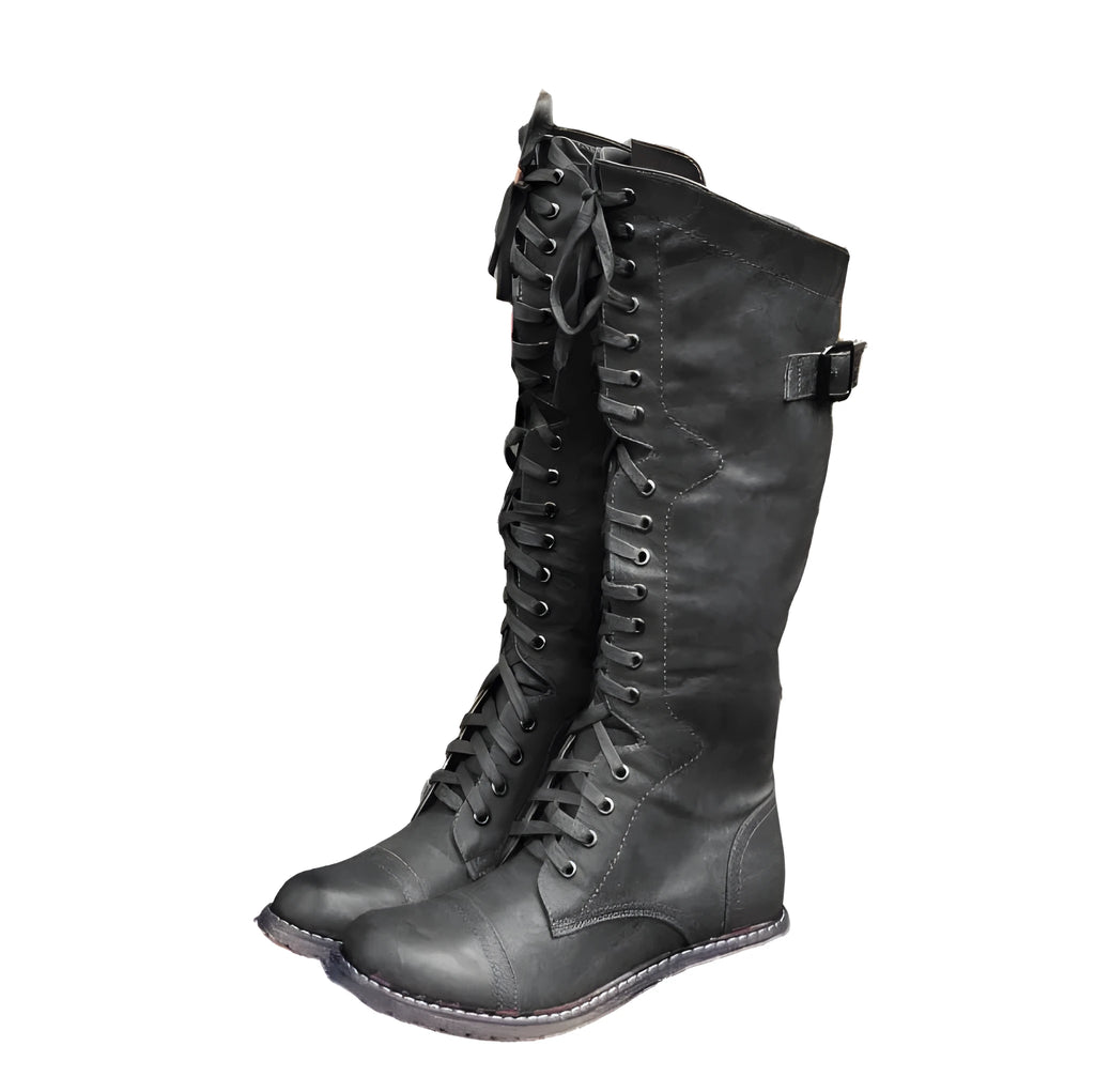 Women's black cross-strap knight boots made from artificial PU, side view.
