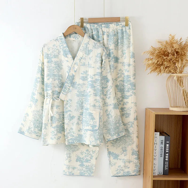 Women's pink pure cotton gauze long sleeve pyjama set with lace-up trousers laid flat.